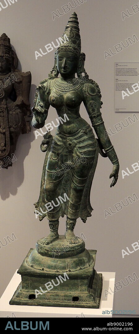 Uma. India, Tamil Nadu, 15th-16th century, bronze. The blue water lily in the figure's right hand shows that this is the goddess Uma (also known as Parvati), wife of the Hindu god Shiva. She is standing in an elegant pose, with her body slightly angled at the hip and neck. In a temple she would have stood to the left of Shiva, her customary position.