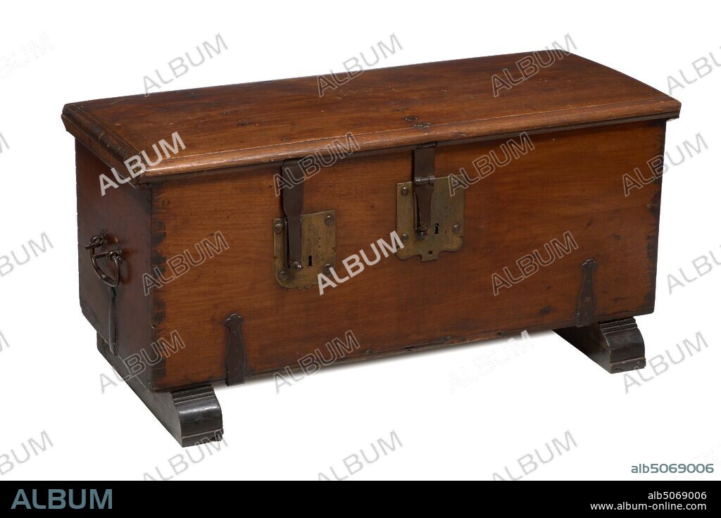 Anonymous, 18th century, cedar wood, copper, brass, General: 60 x 123 x 52cm 600 x 1230 x 520mm, cedar box with copper and brass fittings. The box has two locks. The letters AK are inscribed on the lid. The lid consists of one piece round profiled with rows of seven stud nails fittings, with upright sides, with two wrought iron robberies and copper lock plates with four stud studs. With baffle construction, geometrically cut out. The front, side and bottom have two stocky tail handles. The chest stands on inwardly standing rip legs. The chest has oval carrying handles with two rosettes at the front, Topography guides.