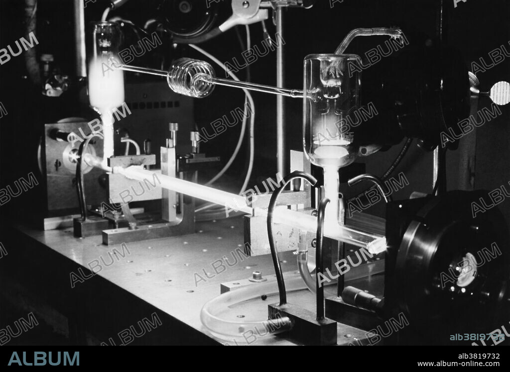 Argon laser used in Raman scattering experiments. In such experiments, a scientist can learn about the atomic structure of a transparent solid or liquid by passing a laser beam through it. When the laser light goes through such a material, it displaces certain atoms and produces mechanical vibrations called phonons. A test instrument called a spectrometer detects these phonons and indicates their intensity and spacing data which are peculiar to the material being studied. The Argon Ion laser was invented in 1964 by William Bridges at Hughes Aircraft.