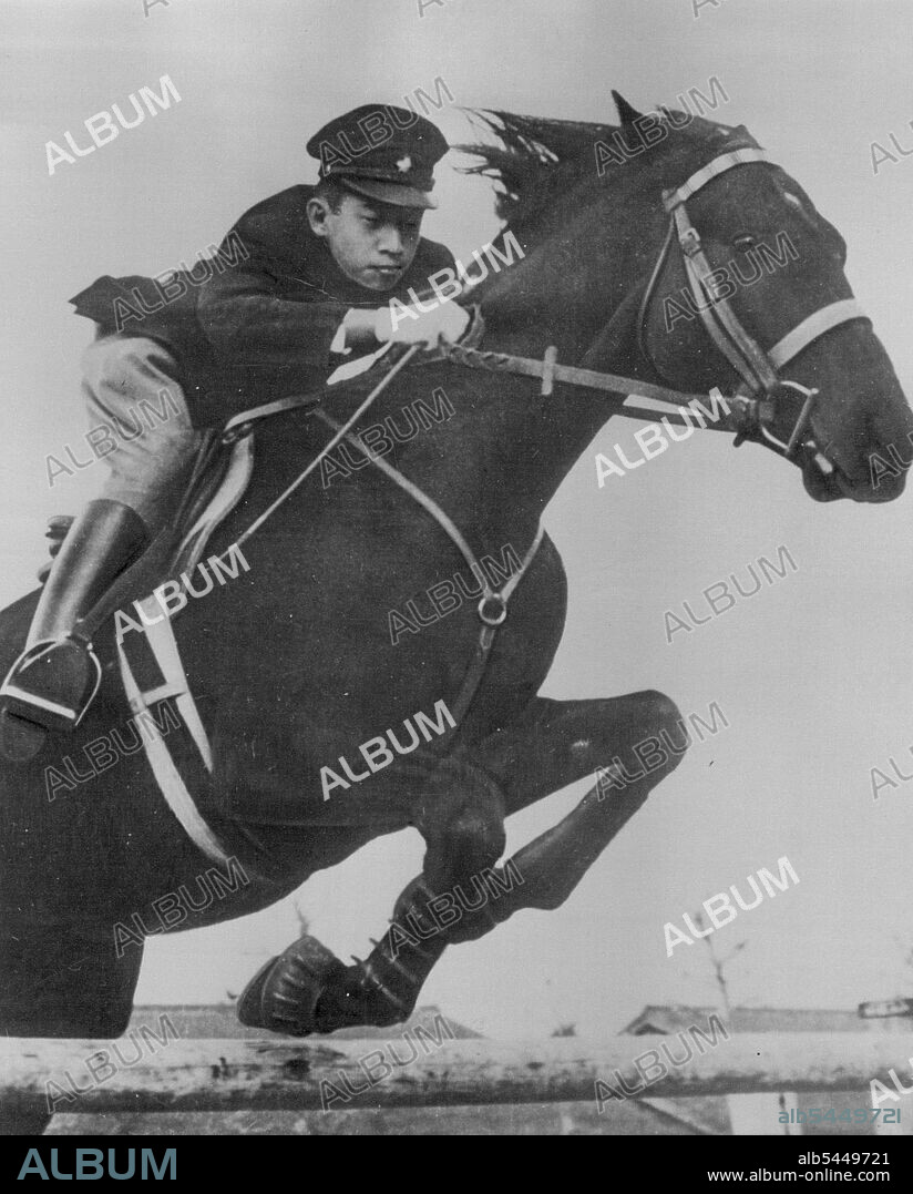 Crown Prince Akihito, 18-year-old son of Japanese Emperor Hirohito, gives a display of horsemanship as he rides his pet horse "Wakazakura" over an obstacle in Tokyo. This picture was taken by photographer of the Japanese Imperial household. December 31, 1951. (Photo by AP Wirephoto).