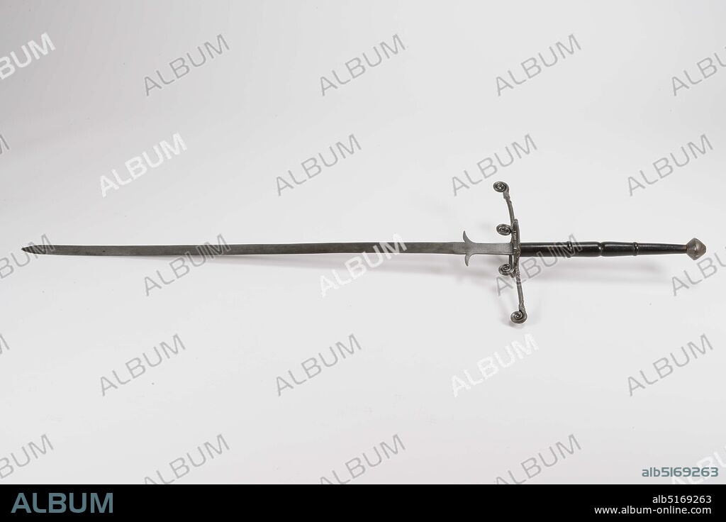 sword, Anonymous, second half of the 16th century, iron, wood, broadsword, so-called 'two-handed sword' of iron with a black-painted wooden handle. The handle has a spool-shaped contour, separated in two parts by a set of thick ridges in the middle. The upper part is octagonal in cross section, the part between the ridges is circular. The knob is made of iron, with a double-conical contour. The bottom part of the handle is smooth, the top half of which is divided into four pointed panels, separated by as many deep grooves, filled with hammered St. Andrew's crosses of double hammered grooves. Grip rings are missing, but a thickened ridge has been cut instead of the bottom one. The cross-guard has flat arms with spiral protrusions, two at the bottom on either side of the side rings and double, at the top and bottom, at the ends. Moreover, these ends have a spiral running transversely thereon (only on one side, outside or carrying side). A further protrusion on the cross-guard is a flat spatula-shaped tip with a small ball. Both flat arms of the cross-guard increase in width towards the ends and are embossed on the flat sides with panels separated by oblique lines, filled with cross grooves, respectively plant motifs. A pair of ring collars, round in cross section and oval in plan view, each have two thickenings with spiral wound surfaces and are at some distance from two baffle plates with serrated edges. Dimensions Catalog dimensions: total length 180.3 cm; blade length 128 cm x width 4.5 cm; guard 58.8 cm, General: 181.5 x 56.6 x 15.6cm (1815 x 566 x 156mm).