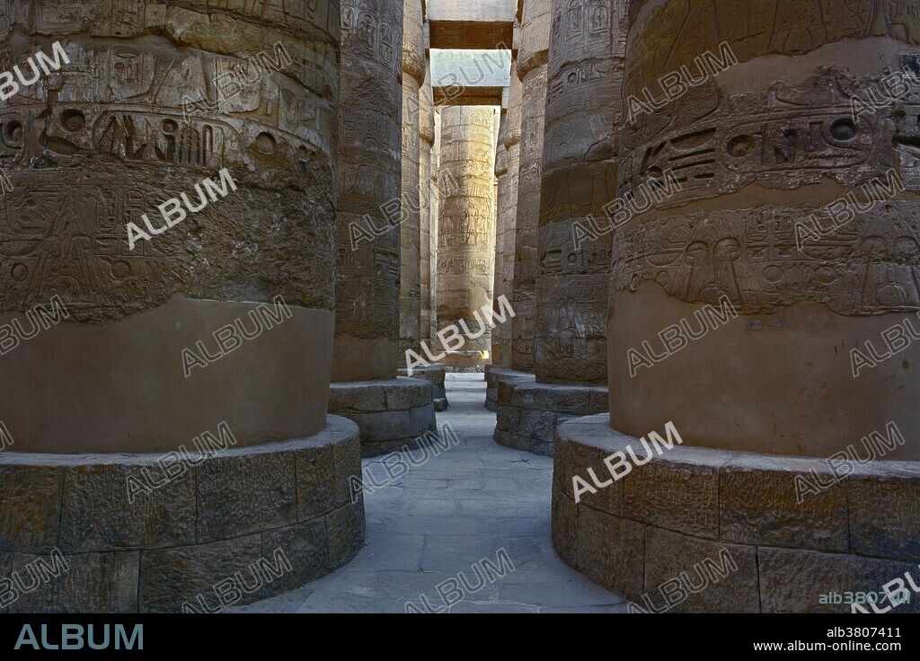 Massive columns of the Hypostyle Hall, in the Precinct of Amun-Re, part of the Karnak temple complex, north of modern day Luxor or ancient Thebes. The complex is widely considered the largest temple complex every built by man. The Hypostyle Hall was constructed during the Nineteenth Dynasty.