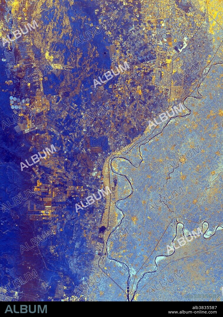 This spaceborne radar image shows the area just north of the city of Cairo, Egypt, where the Nile River splits into two main branches. The Rosetta Branch is the curving dark line in the center of the image and the Damietta Branch is the curving dark line in the lower right of the image. The light blue area on the right half of the image is a portion of the Nile River Delta. The thinner, straighter lines and the small network of gold lines are irrigation canals. There are more than 10,000 kilometers of canals throughout the Nile Delta. A transition zone of irrigated fields is shown in blue and yellow between the irrigated delta and the surrounding desert. The desert is the dark blue area on the left side of the image lacking the pattern of irrigated fields. This image was acquired by the Spaceborne Imaging Radar-C/X-band Synthetic Aperture Radar (SIR-C/X-SAR) on October 4, 1994, onboard the space shuttle Endeavour.