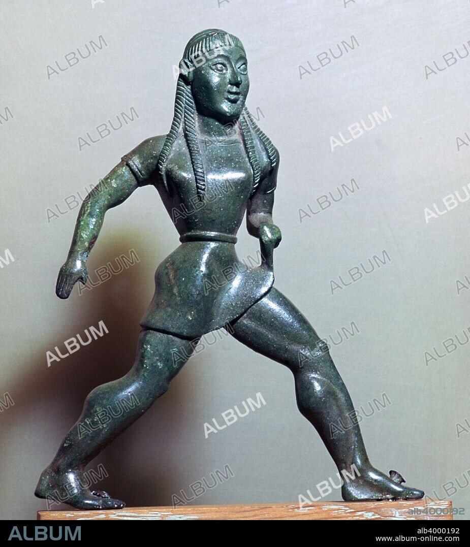 Archaic bronze statuette of a Spartan female athlete, running and holding her gymnos. From the National Museum in Athens.