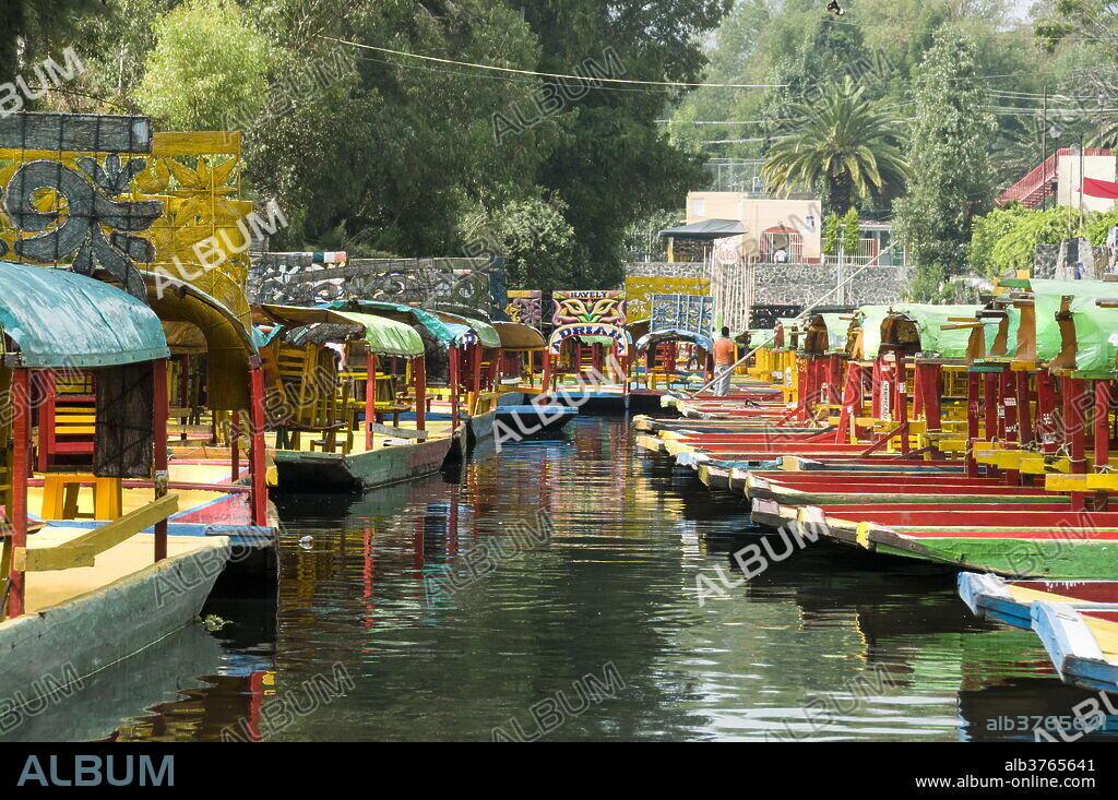 Colourful boats at the Floating Gardens in Xochimilco, UNESCO World Heritage Site, Mexico City, Mexico, North America.