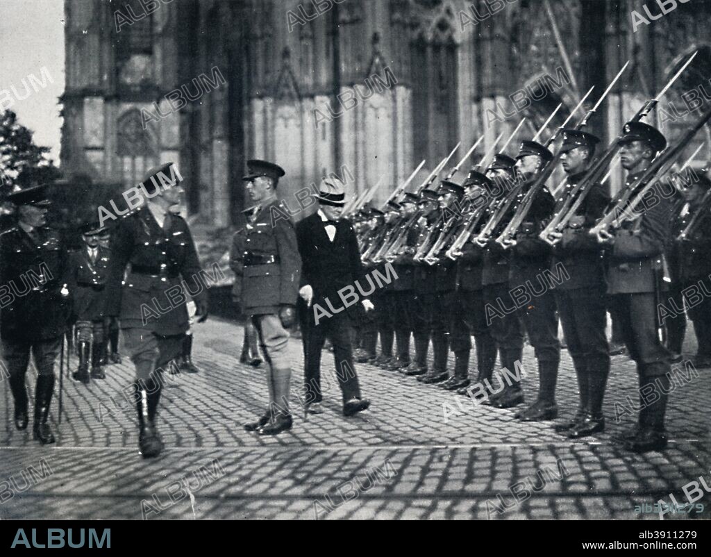 'Inspection of troops at the foot of Cologne Cathedral', 1919 (1945). Winston Churchill and Sir William Robert Robertson inspecting troups in Cologne. From Winston Churchill: His Life in Pictures, by Ben Tucker. [Sagall Press, Ltd., London, 1945].