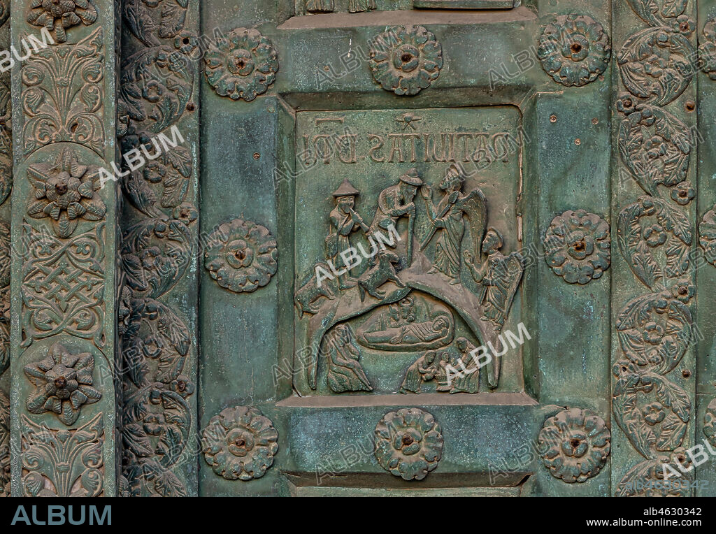 Monreale Cathedral, the gate by Bonanno Pisano (1185-6): bronze tile depicting "Jesus' Nativity" (scene of the New Testament).. The gate is signed "Bonanno civis pisanus". It depicts five scenes of the Old Testament at the bottom, starting with Adam and Eve, and five scenes of the New Testament at the top, ending in "Christ and Mary in the glory of Paradise".
