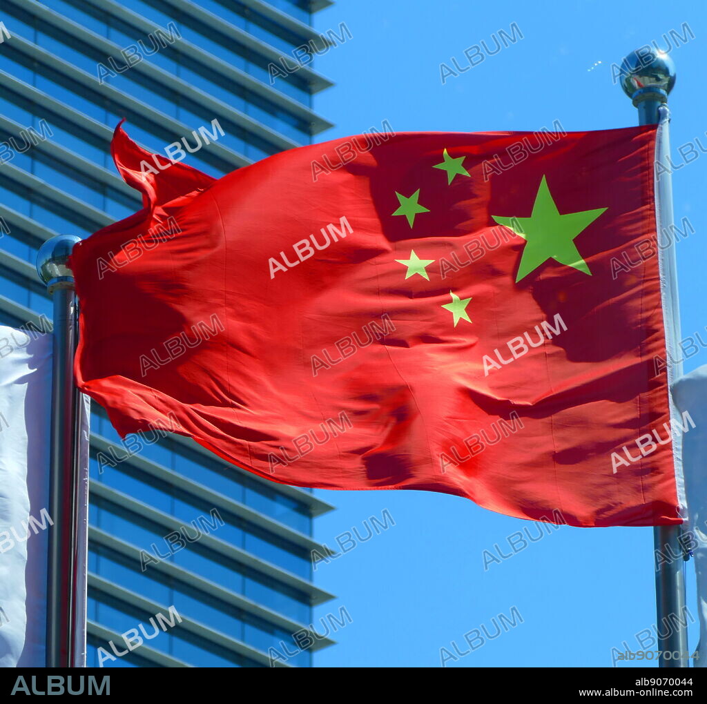 The flag of China, features one large star, with four smaller stars. The red represents the communist revolution; the five stars and their relationship represent the unity of the Chinese people under the leadership of the Communist Party of China (CPC). The first flag was hoisted by the People's Liberation Army (PLA) on a pole overlooking Beijing's Tiananmen Square on October 1, 1949, at a ceremony announcing the establishment of the People's Republic of China.