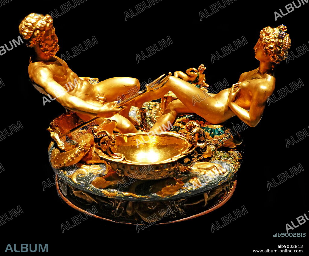 Photograph of the Cellini Salt Cellar (Saliera), a part-enamelled gold table sculpture, by Benvenuto Cellini. It was completed in 1543 for Francis I of France, from models that had been prepared many years earlier for Cardinal Ippolito d'Este. The Cellini Salt Cellar depicts a male figure representing the sea and a female figure that represents the earth. Benvenuto Cellini (1500-1571) an Italian goldsmith, sculptor, draftsman, solider, musician, and artist. Dated 16th Century.
