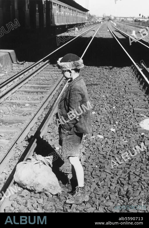 Post-war Berlin / 1946. A small boy with a sack of coal at a Berlin S-Bahn station. Photo, 1946.