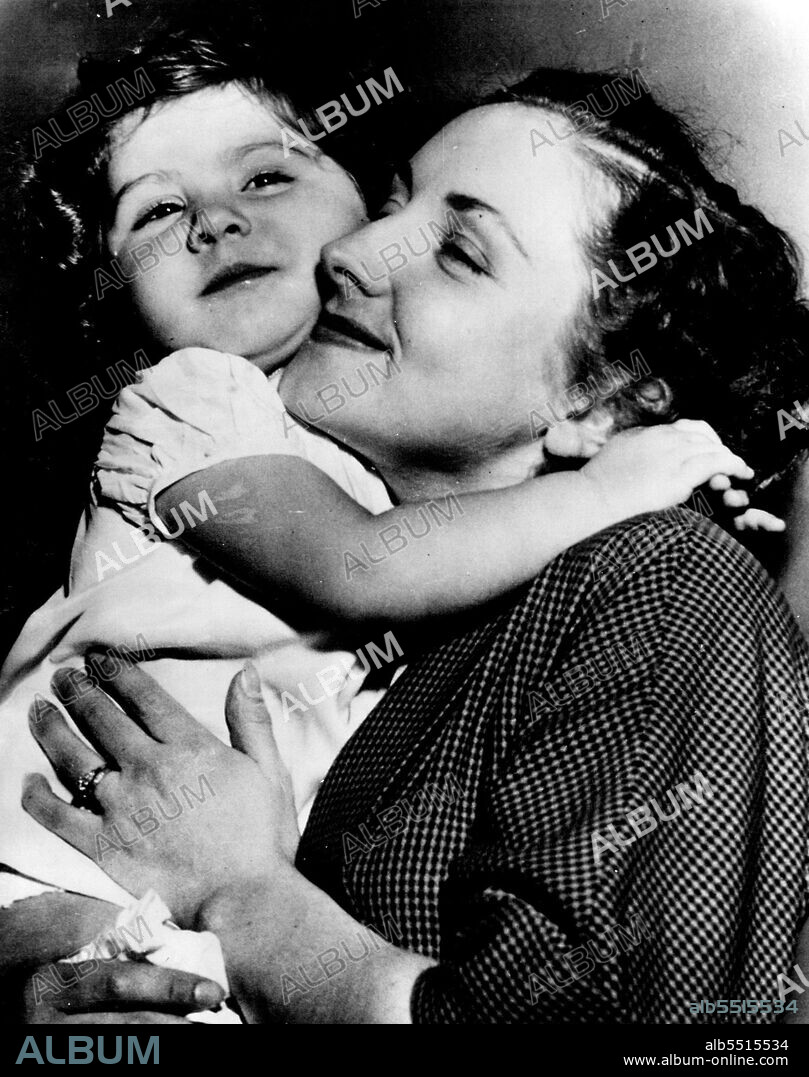 Names 'Elephant Boy' Sabu As Father -- Brenda Marian Julier, an English dancer, holds her two year old daughter, Michaela, as she appeared in court today seeking to have one-time "elephant boy" Saba named father of the child. She testified Actor Sabu, whose real name is Sabu Dastagir, invited her here from England in 1947 and that they lived together for a time a man and wife. Sabu denies being the father. October 10, 1950. (Photo by AP Wirephoto).