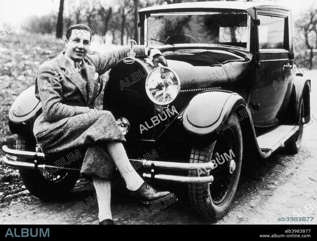 Jean Bugatti pictured with a Bugatti car, 1930s. The son of Ettore Bugatti, the founder of Bugatti. By 1936 he was made a director at his father's factory. He died in 1939 in a test drive accident.