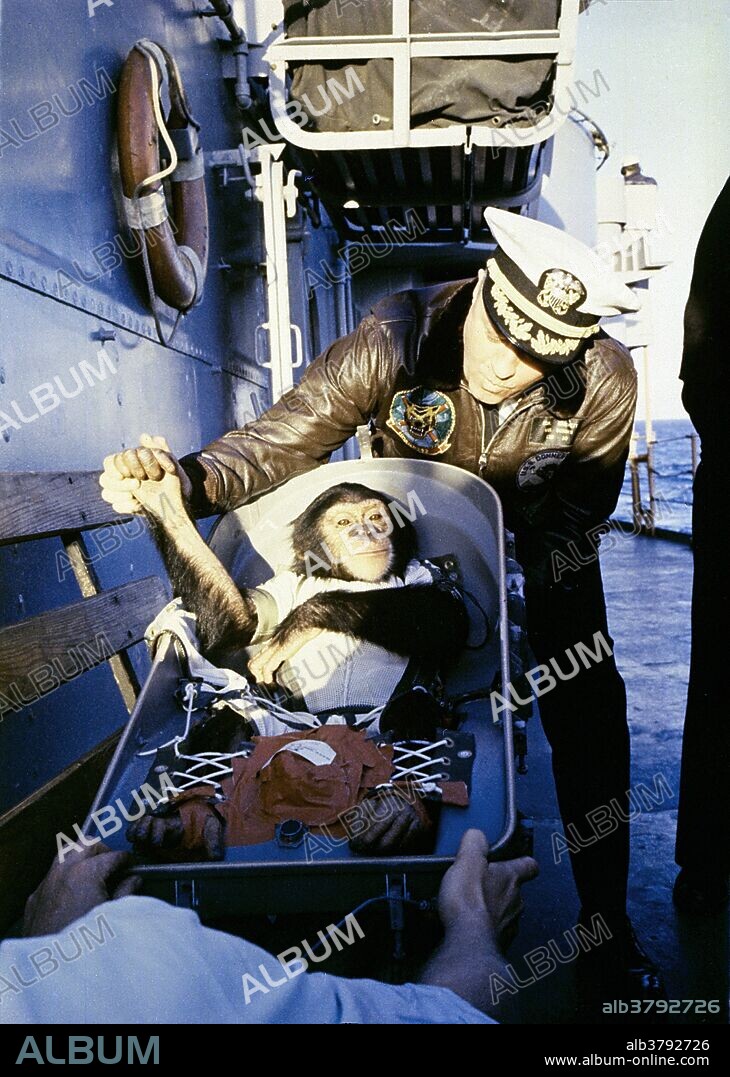The famous "hand shake" welcome. After his flight on a Mercury-Redstone rocket, chimpanzee Ham is greeted by the commander of the recovery ship, USS Donner. On January 31, 1961, a Mercury-Redstone launch from Cape Canaveral carried the chimpanzee, Ham, over 400 miles down range in an arching trajectory that reached a peak of 158 miles above the Earth. The mission was successful and Ham performed his lever-pulling task well in response to the flashing light. NASA used chimpanzees and other primates to test the Mercury capsule before launching the first American astronaut Alan Shepard in May 1961. The successful flight and recovery confirmed the soundness of the Mercury-Redstone systems.