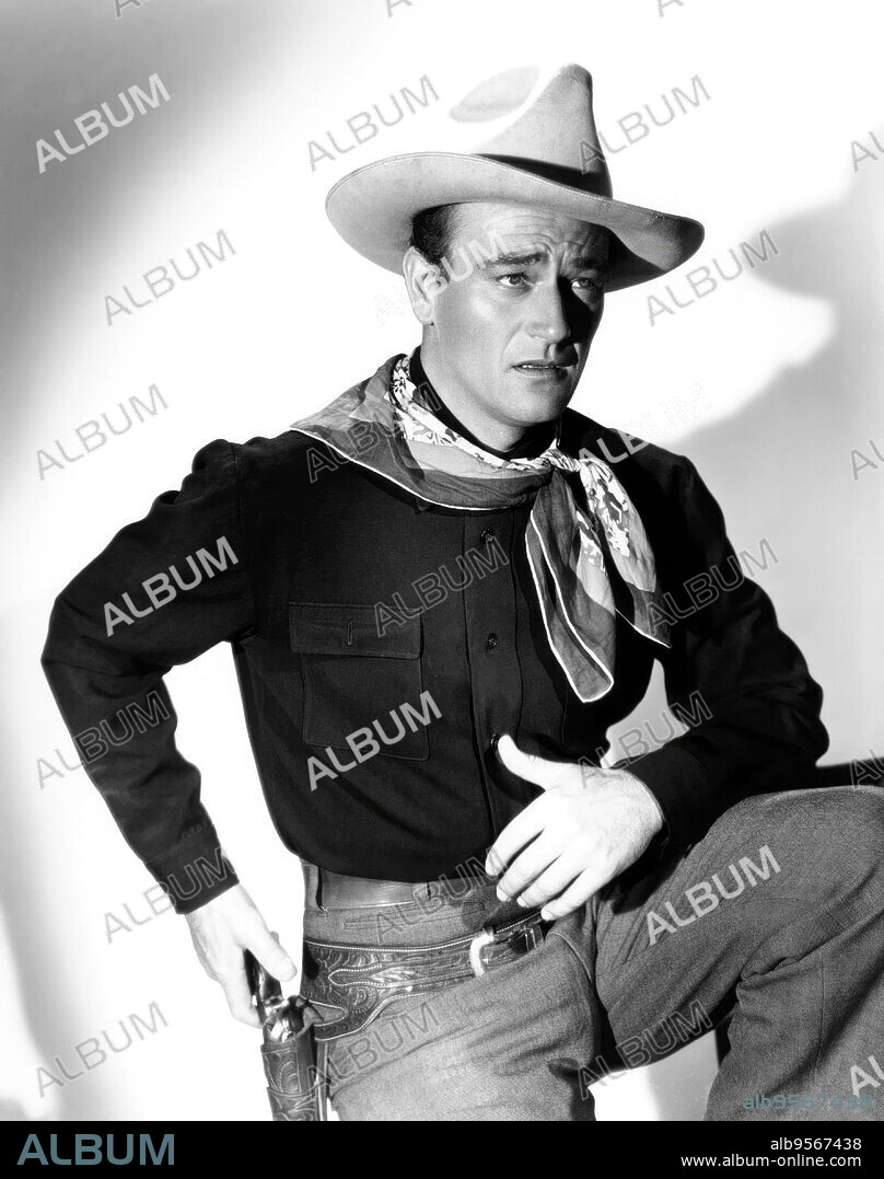 JOHN WAYNE in WAR OF THE WILDCATS, 1943 (IN OLD OKLAHOMA), directed by ALBERT S. ROGELL. Copyright REPUBLIC PICTURES.