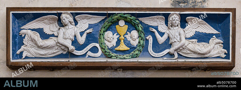 Basilica of the Holy Cross: "Two Angels adoring the Eucharist Chalice", end XV century, by Andrea Della Robbia, lunette, bas-relief polychrome glazed terracotta.