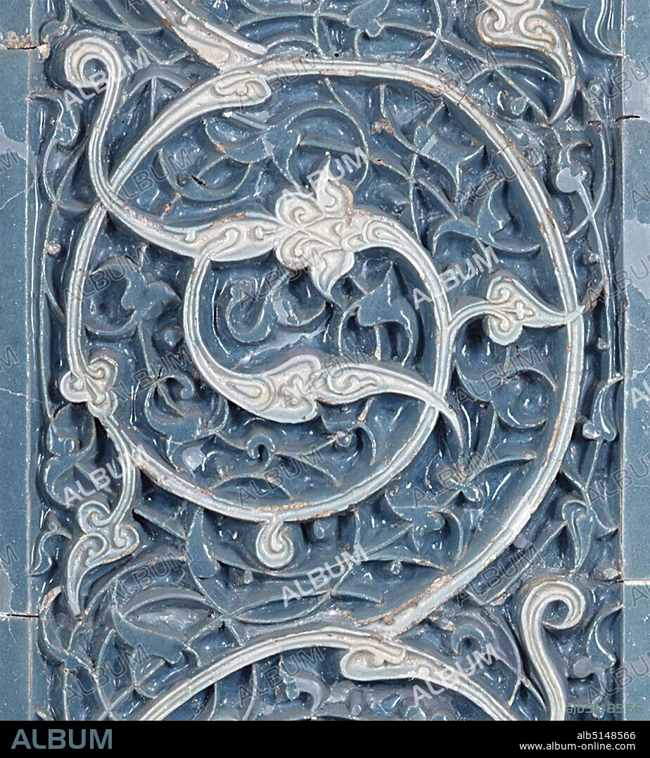 Tiles from the mausoleum of Buyan Kuli Chan, clay, fritted porcelain, reliefs, underglaze decoration, Total: Height: 125 cm; Width: 59 cm, architectural decoration, ceramics, Islam, grave equipment, interior decoration, tendril ornament, These tiles come from the mausoleum of King Buyan Kuli Khan, who was murdered in 1358. He was the 25th successor of Genghis Khan (1155/62/67-1227) and ruled over a part of the huge empire of the Mongols. His tomb stands in Bukhara, a city in today's Uzbekistan, and was covered with tiles inside and outside. The field with the spiral tendril comes from the outer facade. The ornament is not painted on here, but cut into the clay as a relief in an elaborate technique.