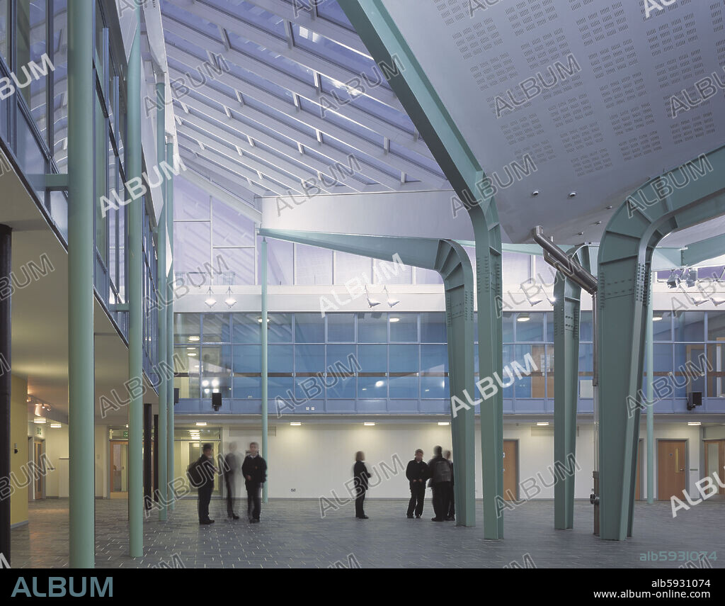 CHARTER SCHOOL ATRIUM VIEW AT DUSK.