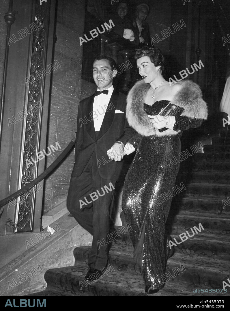 ***** Jane Wyman and husband ***** bandleader Fred Karger, arrive at a recent Hollywood premiere. January 18, 1953.