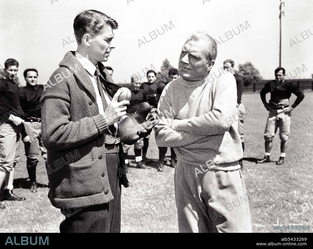 PAT O'BRIEN and RONALD REAGAN in KNUTE ROCKNE ALL AMERICAN, 1940, directed by LLOYD BACON. Copyright WARNER BROTHERS.