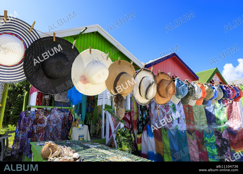 Long Bay Beach, colourful tourist souvenir stall and beach huts, blue sky, Antigua, Antigua and Barbuda, Leeward Islands, West Indies, Caribbean, Central America.