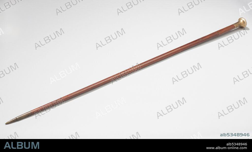 Swagger stick, Royal Flying Corps, ca. 1910s. First World War wood swagger stick with bullet cartridge tip and brass handle, owned by Lt. Wes D. Archer. Wes Archer, an American with Canadian parents, joined the Royal Flying Corps in 1917. He was shot down in 1918. He  returned to the United States in 1920 and wrote "Death in the Air: The War Diary and Photographs of a Flying Corps Pilot".
