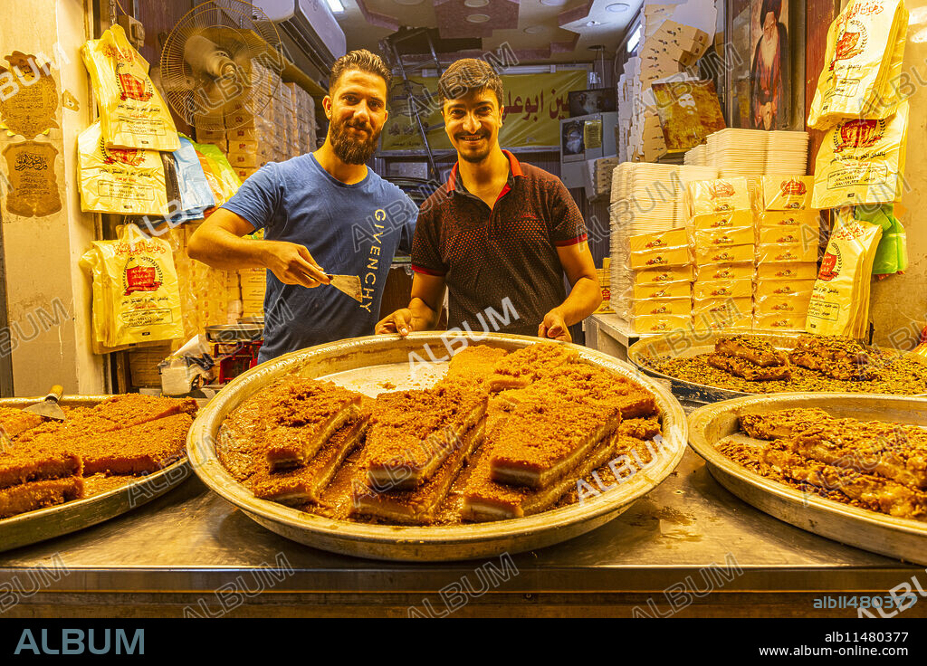 Locals selling sweets, Imam Ali Holy Shrine, Najaf, Iraq, Middle East.