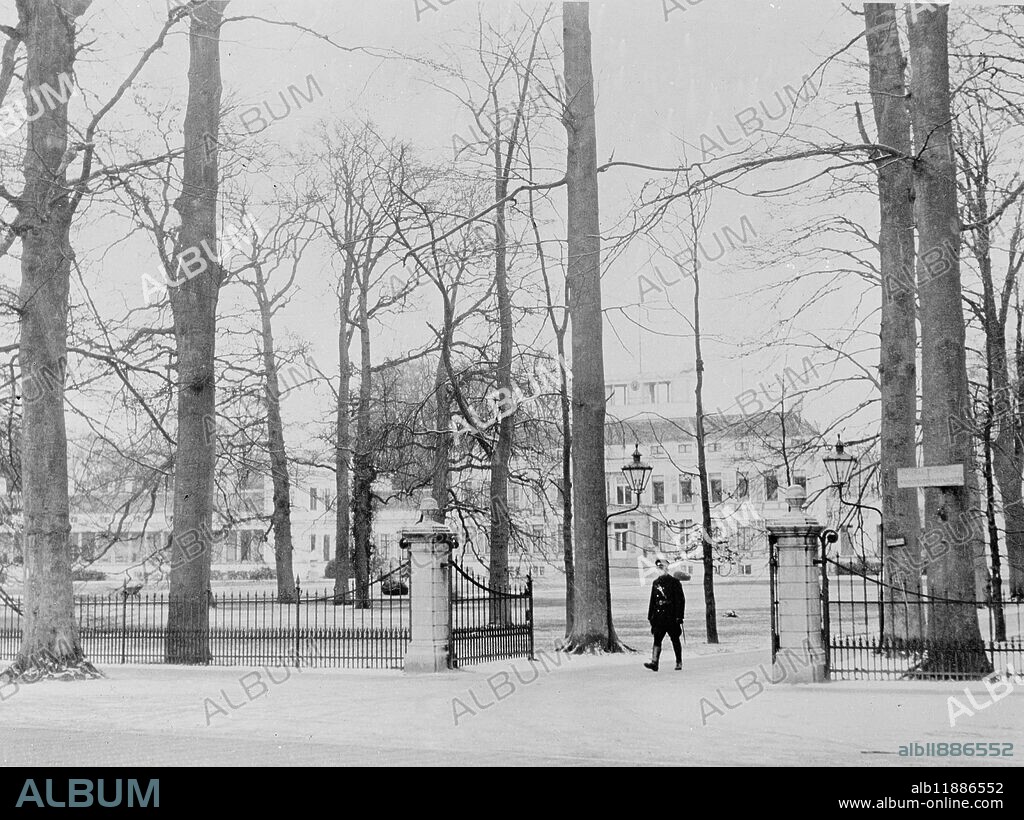 Where Holland's Royal baby will be born. The entrance, with the village policeman on guard, of the Soestdijk Palace, Holland, where Princess Juliana of the Netherlands, is preparing for the birth of her first baby. Soestdijk was her wedding gift from the people of Holland, all of whom are now trying that her baby will be a boy, and Holland's first male heir to the throne for many years. The baby is expected about the middle of this month, January. It is expected that Prince Bernhard, recently badly injured in a car smash, will be moved from Amsterdam hospital to the Palace. 4 January 1938.