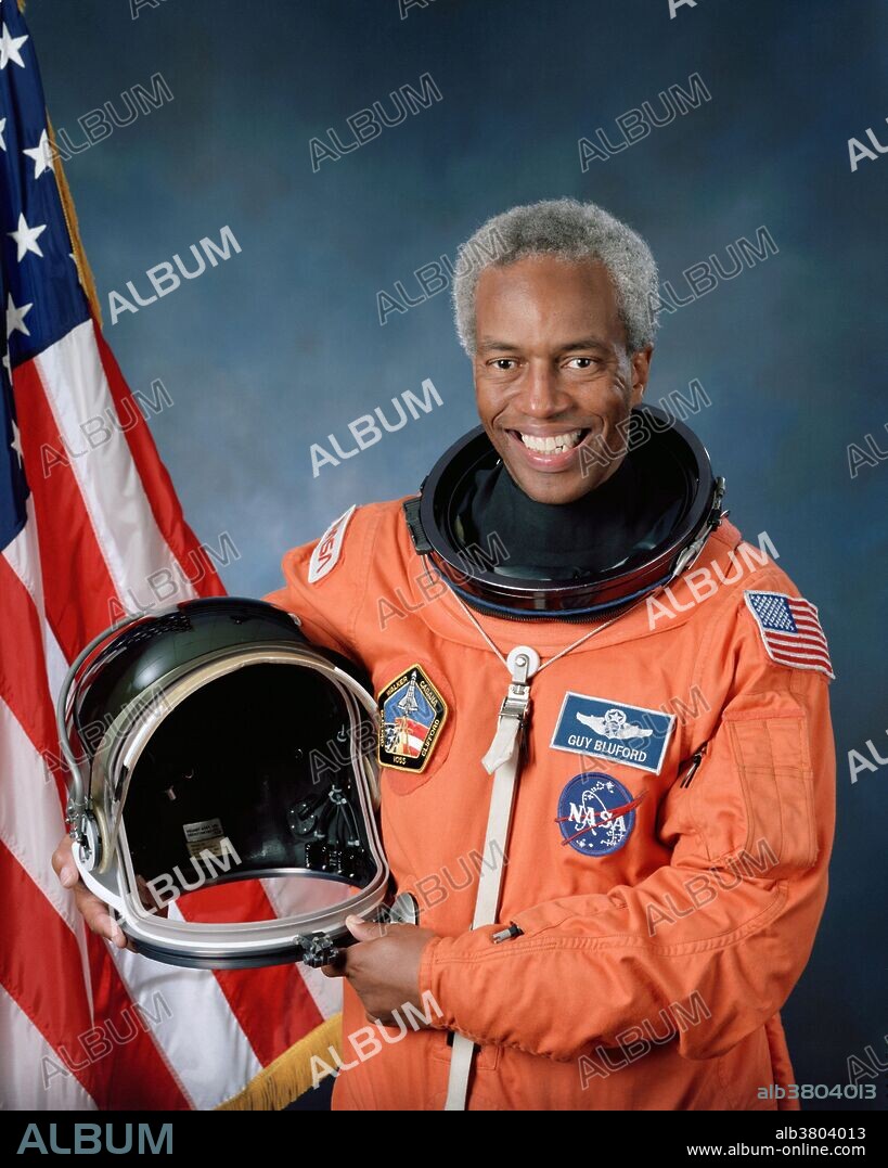 Entitled: "Official portrait of astronaut Guion S. Bluford." Guion Stewart "Guy" Bluford, Jr. (born November 22, 1942) is an engineer, and retired NASA astronaut. He attended pilot training at Williams Air Force Base, and received his pilot wings in 1966. He was assigned to the 557th Tactical Fighter Squadron, Cam Ranh Bay, Vietnam where he flew 144 combat missions. In 1972, he entered the Air Force Institute of Technology residency school at Wright-Patterson Air Force Base. Upon graduating in 1974 with his master's degree, he was assigned to the Air Force Flight Dynamics Laboratory, as a staff development engineer. He was chosen to become a NASA astronaut in 1979. He was a mission specialist on STS-8, STS-61-A, STS-39, and STS-53. In 1983, as a member of the crew of the Challenger on the mission STS-8, Bluford became the first African-American in space. He left NASA in 1993. Bluford was inducted into the International Space Hall of Fame in 1997. In 2002, scholar Molefi Kete Asante listed him on his list of 100 Greatest African- Americans. He was inducted into the US Astronaut Hall of Fame in 2010.