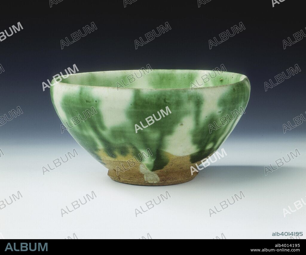 Green lead glazed bowl, Liao dynasty, china, 11th century. An earthernware bowl with full body and slightly incurving rim covered both inside and out with a splashed emerald-green glaze over a white slip. The glaze goes down three quarters of the exterior, the unglazed parts reveal the clay body.