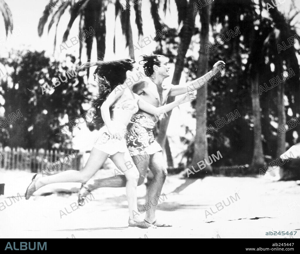 DOROTHY LAMOUR and JON HALL in THE HURRICANE, 1937, directed by JOHN FORD. Copyright UNITED ARTISTS.