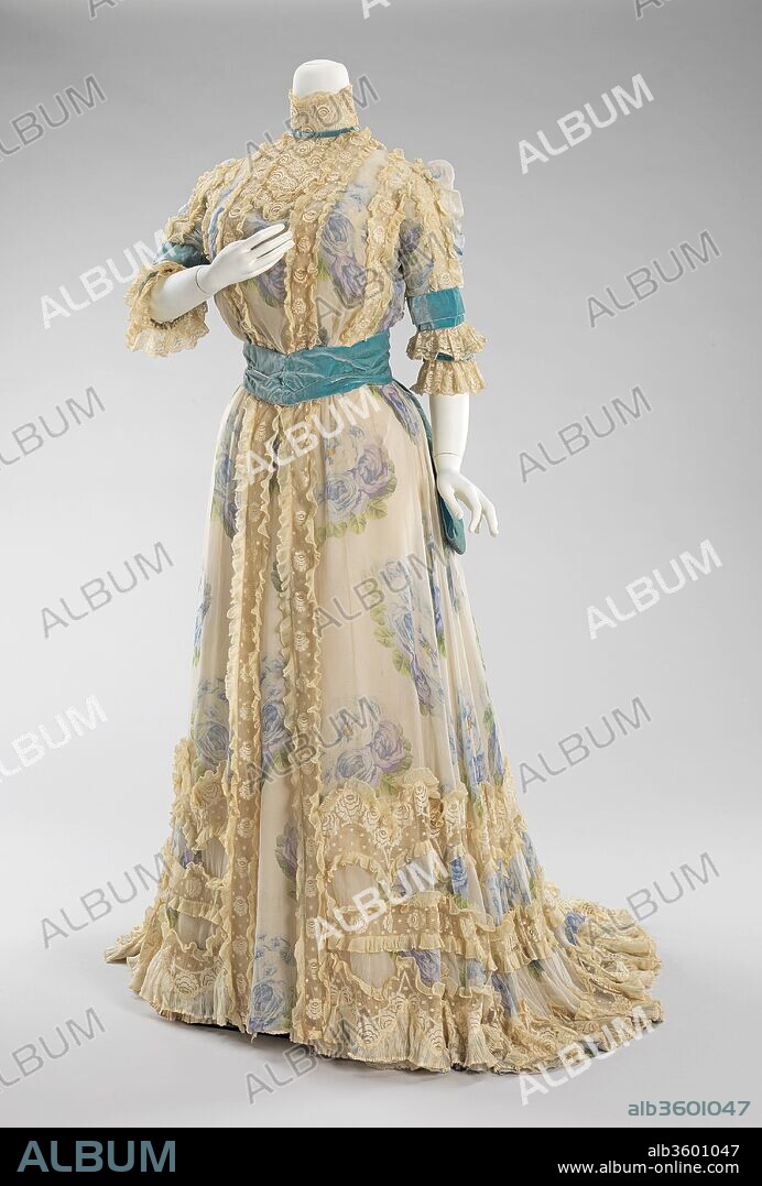 Afternoon dress. Culture: French. Designer: Jacques Doucet (French, Paris 1853-1929 Paris). Date: 1900-1903.
Jacques Doucet was first, and foremost, a connoisseur of art.  Additionally, his passion for the refined and exquisite overflowed into his dealings with fashion, making him one of the finest French couturiers during the Belle Époque.  The House of Doucet began as a family business, specializing in women's lingerie and laces, as well as articles of clothing for men.  Founded in 1817, the company rose to fame under the hand of Jacques.  The house was known for its luxurious offerings, which were worn and coveted by royalty, members of the elite society in both Europe and America, and actresses of the stage.
This is an elegant afternoon dress that would be suitable for afternoon events, such as the races and other promenade activities.  The dress is an excellent example of Doucet's penchant for lingerie-like garments, which is represented by the delicate ruffles and rose printed chiffon.  The color combination of blues accented with turquoise is a favorite of the designer.