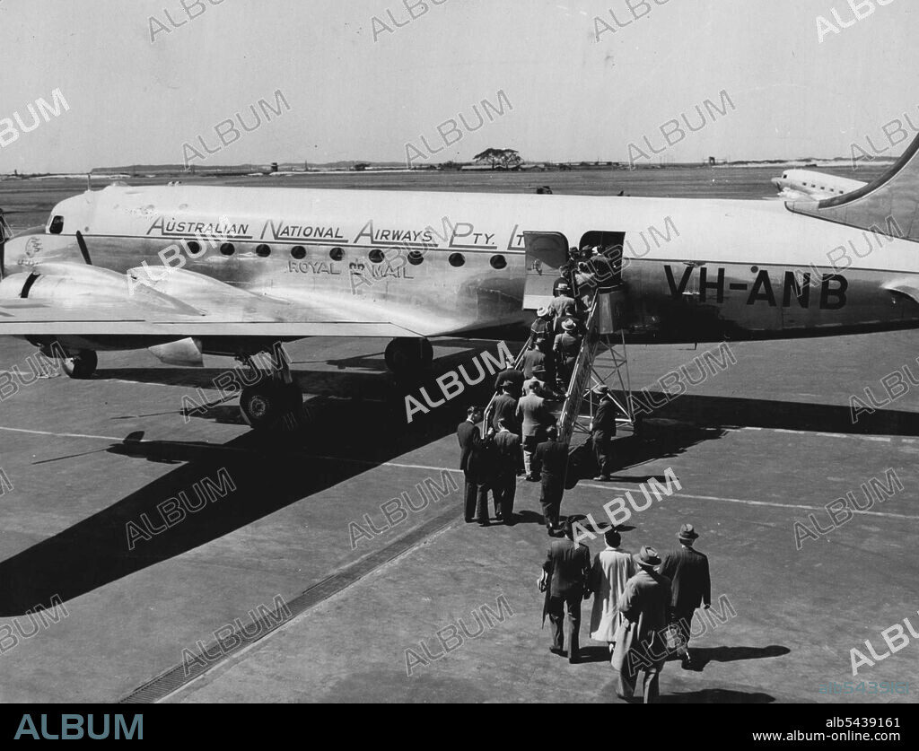 A.N.A. Special Melbourne Cup Flight passengers are boarding their Skymastar at Mascot early this morning. Special flights left every few minutes for Melbourne. Passengers were given race books, cut lunches, and will be treated to a special Cup Dinner at Essendon tonight. November 9, 1953. ;A.N.A. Special Melbourne Cup Flight passengers are boarding their Skymastar at Mascot early this morning. Special flights left every few minutes for Melbourne. Passengers were given race books, cut lunches, an.