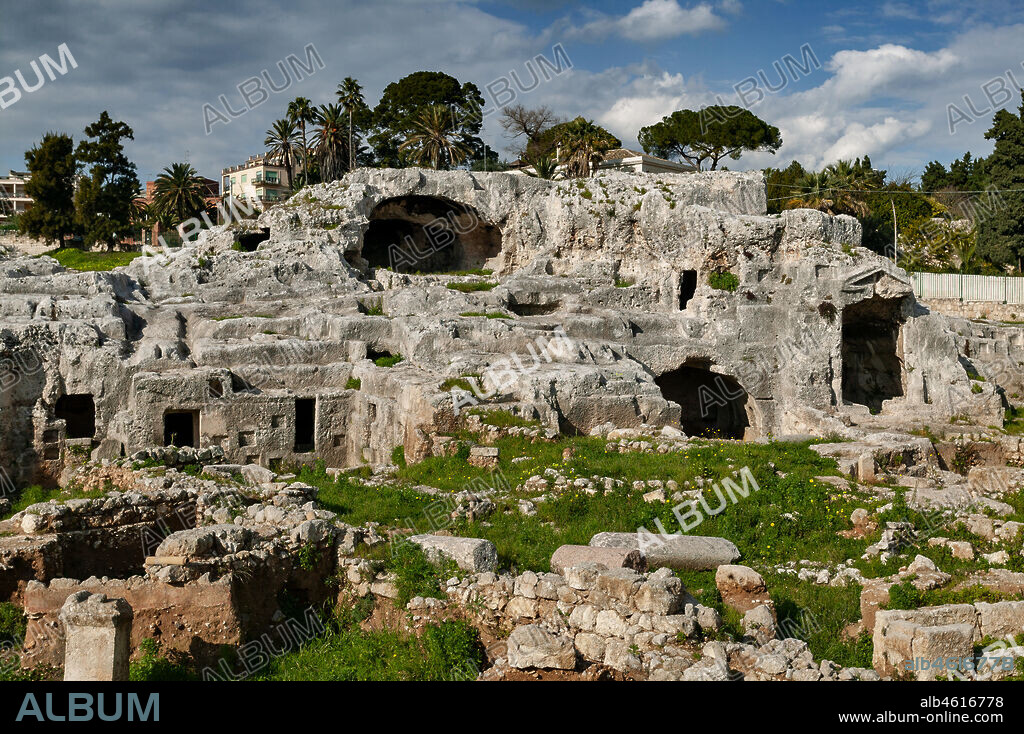 Syracuse, The Archaeological Park of the Neapolis of Syracuse: view on the Grotticelle necropolis. On the right, the so-called Tomb of Archimedes which is, as a matter of fact, a tomb dedicated to illustrious personalities of the Roman Syracusan period.
