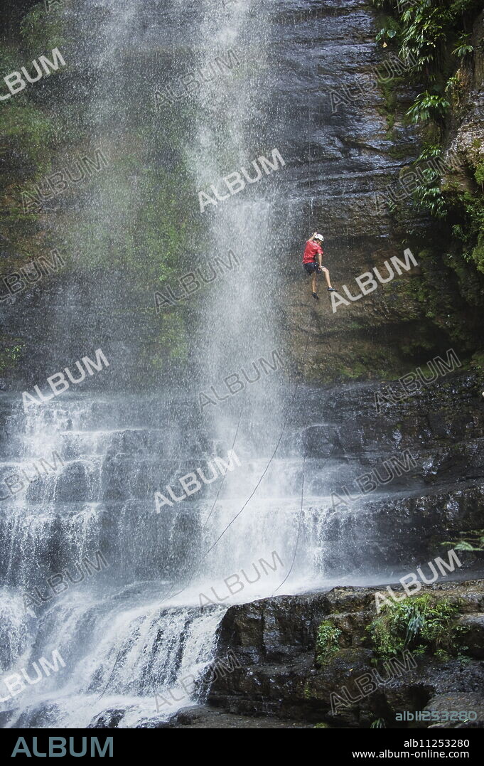 Rappelling on Juan Curi waterfall, adventure sports capital of Colombia, San Gil, Colombia, South America.