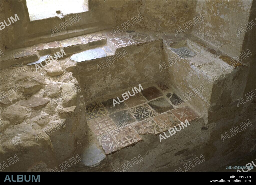 Window seat at Cleeve Abbey, Somerset, 1999. Cleeve Abbey was founded as a Cistercian monastery in 1198 and many of the surviving buildings date from the 13th century. The dormitory at Cleeve is one of the best examples in England. It contained a number of tiled window seats.