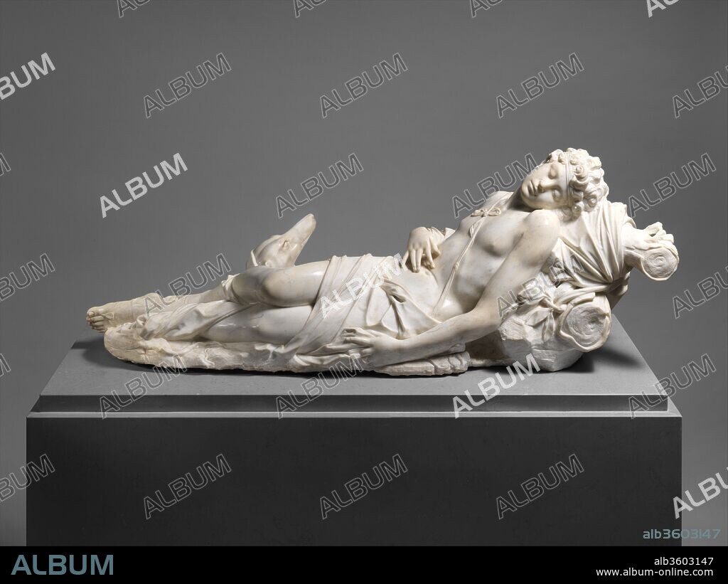 Adonis. Artist: Antonio Corradini (Italian, Venice 1688-1752). Culture: Italian, Venice. Dimensions: Overall (Wt. confirmed): 21 × 56 × 21 in., 527lb. (53.3 × 142.2 × 53.3 cm, 239.0456kg). Date: ca. 1723-25.
When this sculpture was displayed in the Venetian palace of the Sagredo family, the subject was identified as the mythological huntsman Adonis, beloved of the goddess Venus. Its companion statue of Venus is now lost. Adonis's languid pose and highly polished flesh combine the innocently unaware and erotically tactile in a way that might charm a passing love goddess. However when Adonis is represented prone he should be dying of his wounds. Corradini seems to have used events from another myth--that of the sleeping youth Endymion whose beauty caused Diana to fall for him.