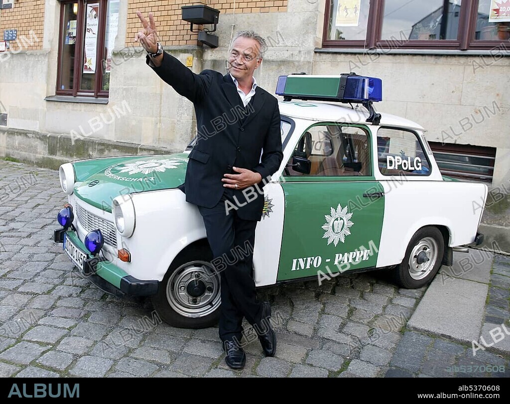 Klaus J. Behrendt, actor, "Tatort", German TV crime series, in front of a police Trabant car.