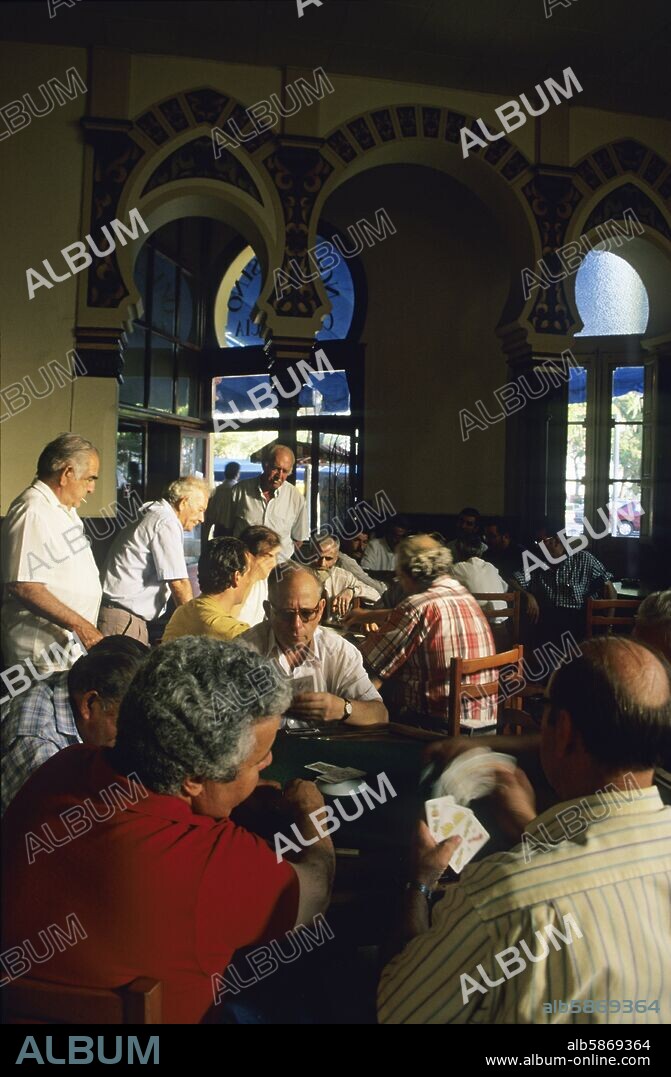 Sant Feliu de Guíxols, "Casino" bar interior; retired men playing cards (Baix Empordà / Costa Brava region).