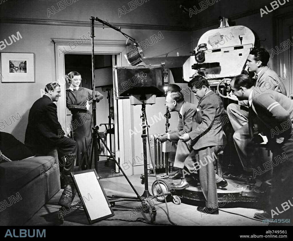JAMES WONG HOWE, MYRNA LOY, SAM WOOD and SPENCER TRACY in WHIPSAW, 1935, directed by SAM WOOD. Copyright M.G.M.