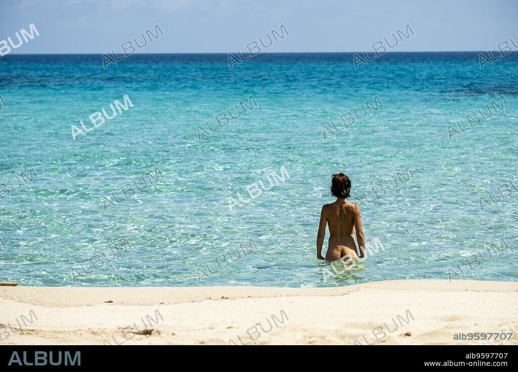 woman practicing naturist nudism, Arenalet de Aubarca, Arta, Mallorca, Balearic Islands, Spain.