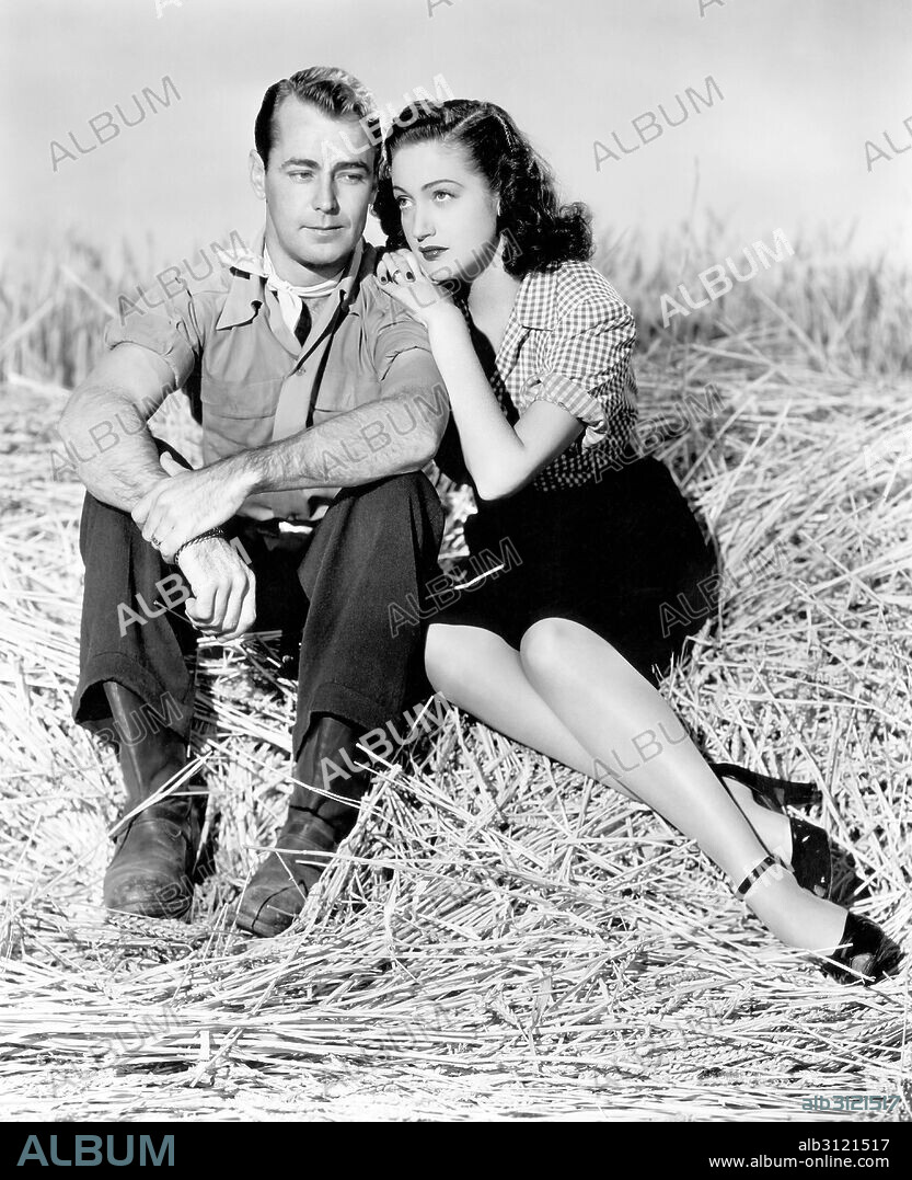 ALAN LADD and DOROTHY LAMOUR in WILD HARVEST, 1947, directed by TAY GARNETT. Copyright PARAMOUNT PICTURES.