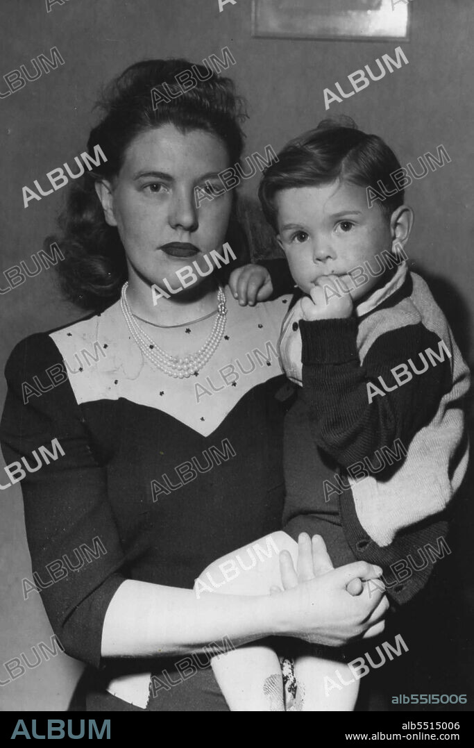 Boxer's window. Mrs. Archie Kemp and her 2½-year-old son, Allan, photographed at their home at Carlton, Melbourne, yesterday. Mrs. Kemp's husband died in St. Vincent's Hospital on Tuesday following his fight with Jacv Hassen on Monday night. Hassen is flying to Melbourne attend the funeral this afternoon. September 22, 1949.