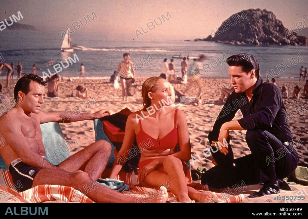 ELVIS PRESLEY and URSULA ANDRESS in FUN IN ACAPULCO, 1963, directed by RICHARD THORPE. Copyright PARAMOUNT PICTURES.