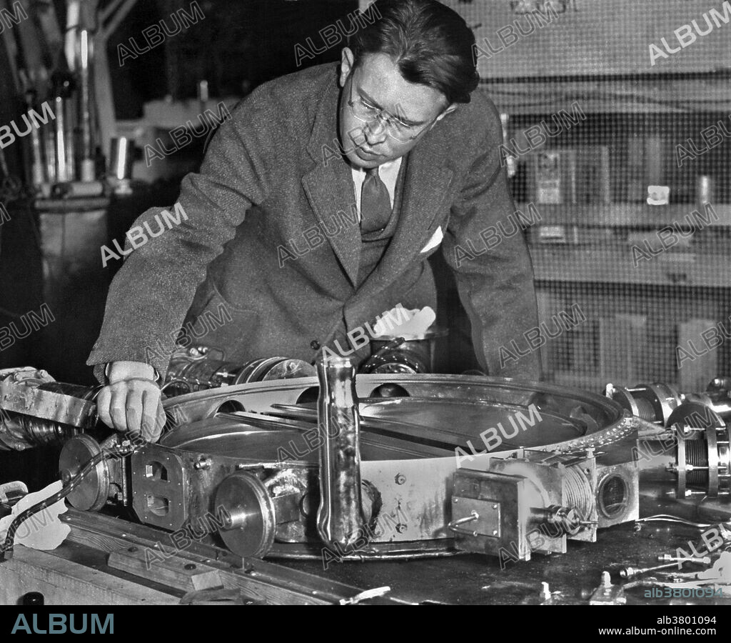 Lawrence examining 37 1/2-inch vacuum chamber with the lid removed, 1935. Ernest Orlando Lawrence (August 8, 1901 - August 27, 1958) was an American physicist and Nobel Laureate, known for his invention, utilization, and improvement of the cyclotron atom-smasher beginning in 1929, based on his studies of the works of Rolf Wideroe, and his later work in uranium-isotope separation for the Manhattan Project. Lawrence had a long career at the University of California, Berkeley, where he became a Professor of Physics. In 1939, Lawrence was awarded the Nobel Prize in Physics for his work in inventing the cyclotron and developing its applications. After the war, Lawrence campaigned extensively for government sponsorship of large scientific programs. Lawrence was a forceful advocate of "Big Science" with its requirements for big machines and big money. He'd died in 1958 at the age of 57. After his death, the Regents of the University of California voted to rename two of the university's nuclear research sites after Lawrence: the Lawrence Livermore and Lawrence Berkeley Laboratories. Chemical element number 103, discovered at LBNL in 1961, is named "lawrencium" in his honor.