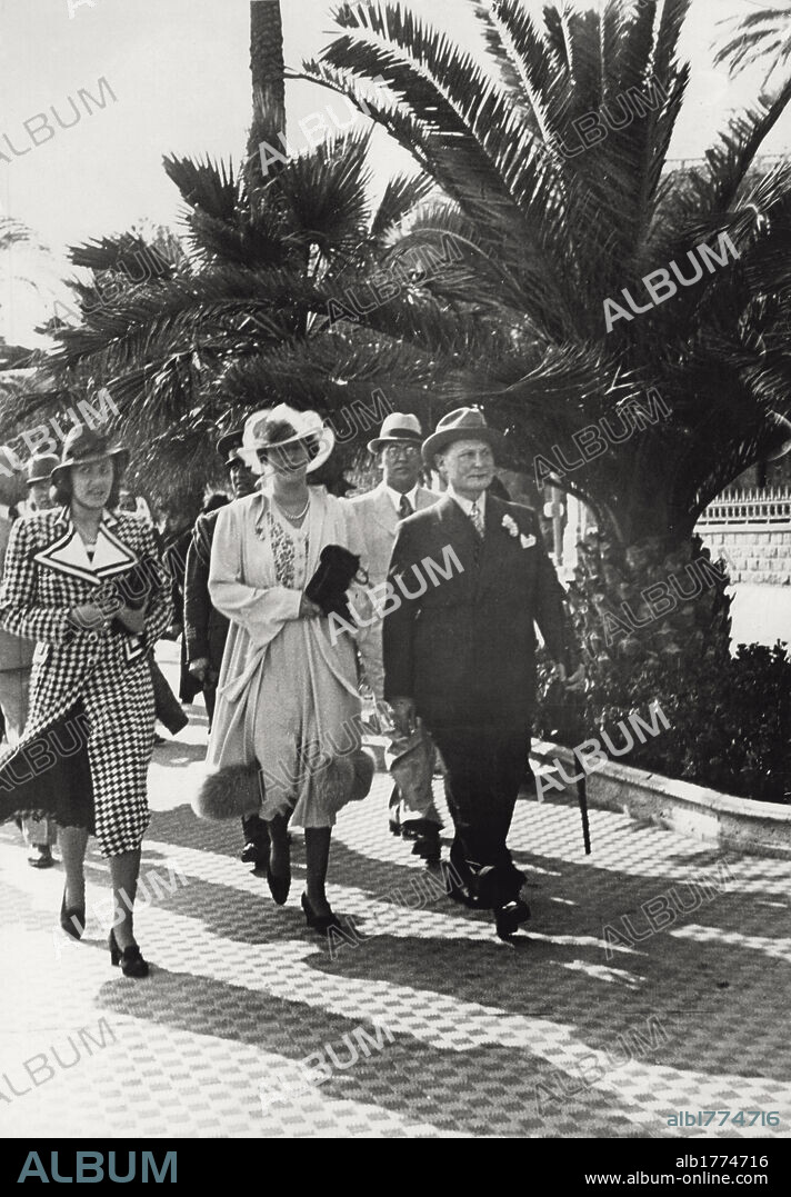 Hermann Goering and his wife Emmy. The German marshal Hermann Goering, in civil dress, is strolling with his wife Emma Johanna Henny Sonnemann, known as 'Emmy', and with some other people, on the seaside of Sanremo. Sanremo (Imperia), February 1938.