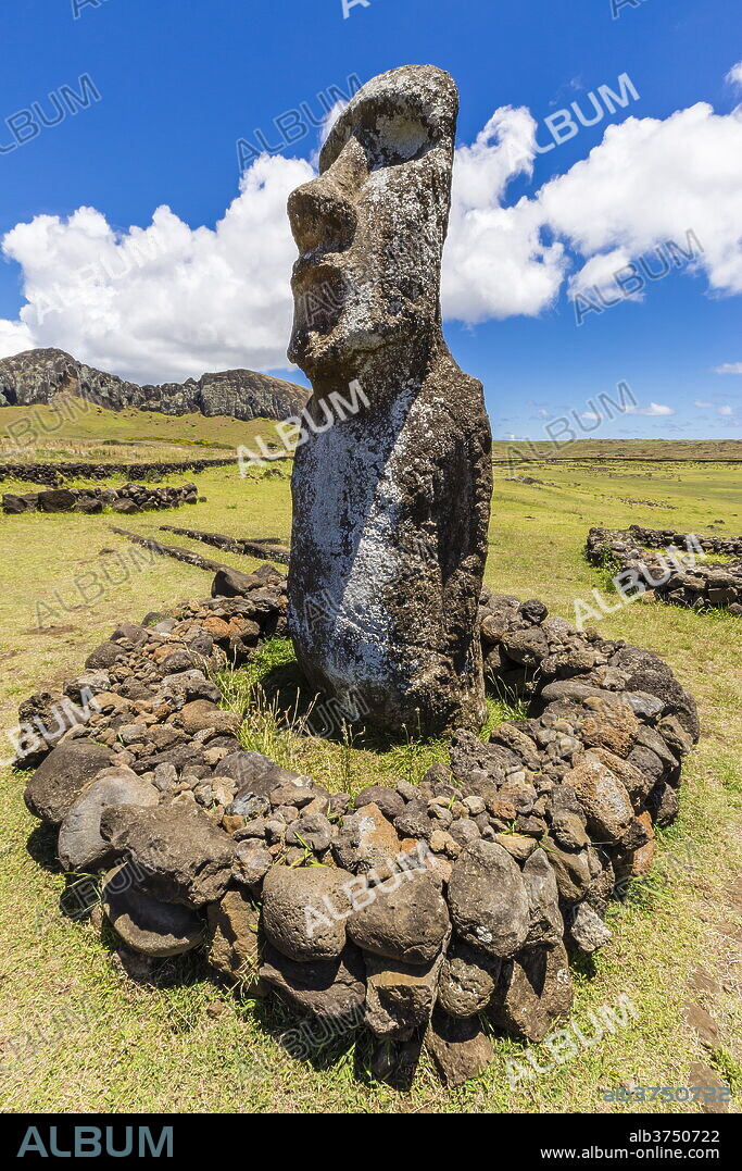 Single moai statue guards the entrance at the 15 moai restored ceremonial site of Ahu Tongariki on Easter Island (Isla de Pascua) (Rapa Nui), UNESCO World Heritage Site, Chile, South America.