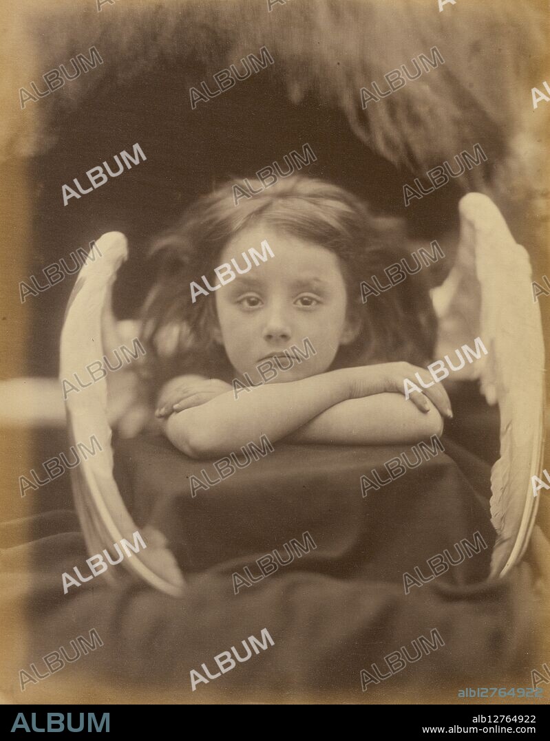 I Wait (Rachel Gurney), 1872. Young Rachel Gurney's forlorn expression does not quite fit her role as an angel, but in a humorous way, her performance supports this photograph's staged look. She is perched on a box that is covered loosely in drapery and positioned stiffly on a table, with fake wings attached to her. Resting her chin on her crossed arms, she appears resigned to her fate of posing for the camera. Pioneering British photographer Julia Margaret Cameron is considered to be one of the most important portraitists of the 19th century. She took up photography at the age of 48, after her daughter gave her a camera as a present.