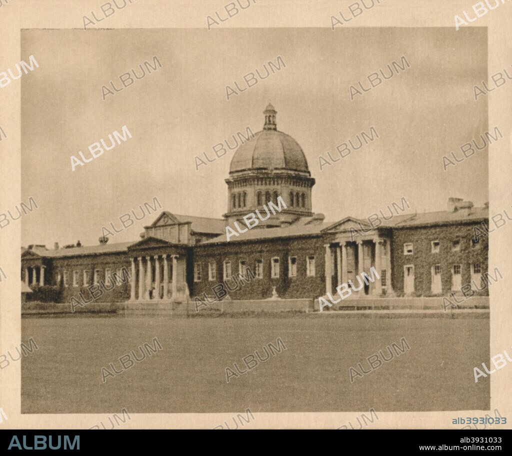 'No. 25 Haileybury College', 1923. Haileybury College, founded in 1862 and qualified under the Royal Charter in 1864. The school occupied the buildings which  formerly belonged to  the Honourable East India Company. The architect was  William Wilkins, also famous for Downing College, Cambridge and the National Gallery, London. From Sunripe Cigarettes - A Series of 50 Public Schools and Colleges. [R. & J. Hill Ltd., London, 1923].