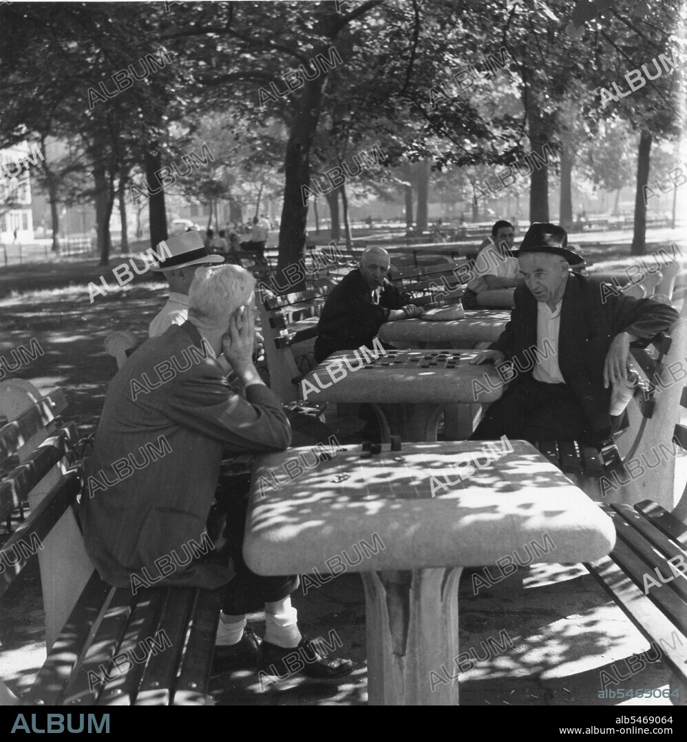Old men playing chess in Washington Square Park. New York, NY, 1954.