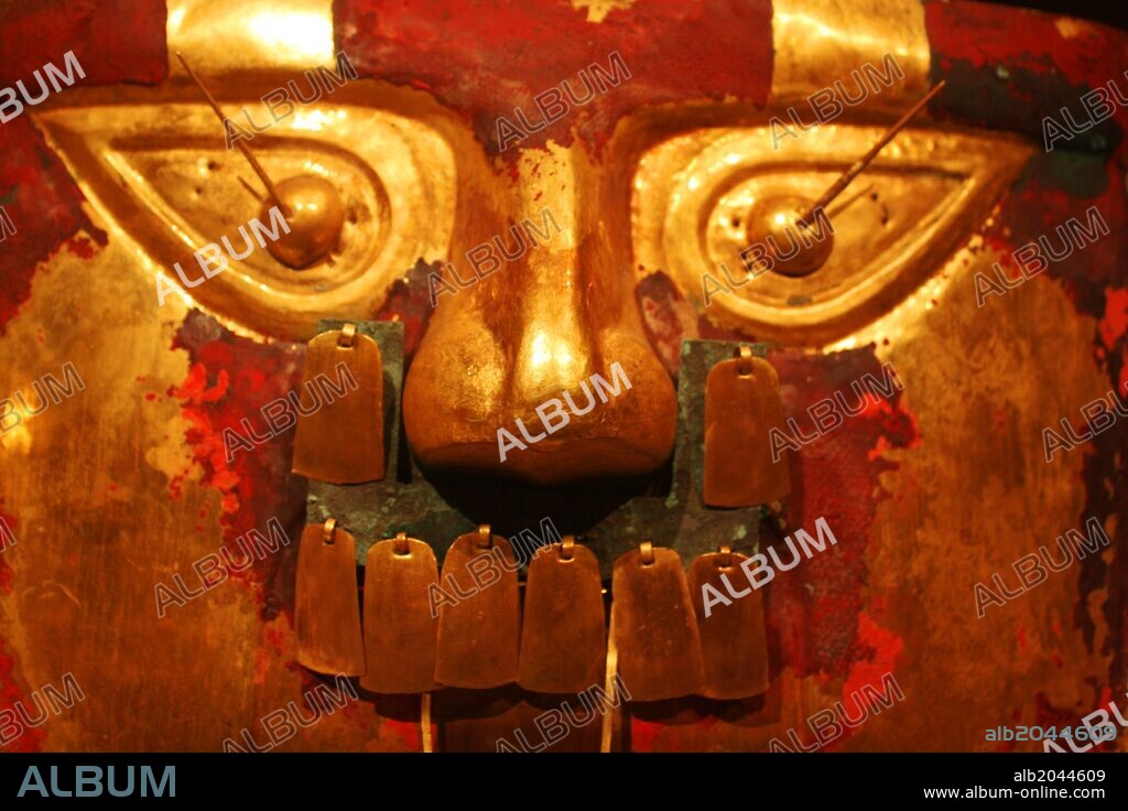 Funerary Mask. Peru; Sican (Lambayeque) 9th-11th century. Hammered gold, cinnabar, copper overlays. The rich tombs of Sican rulers reportedly contained as many as five gold masks along with other precious offerings.